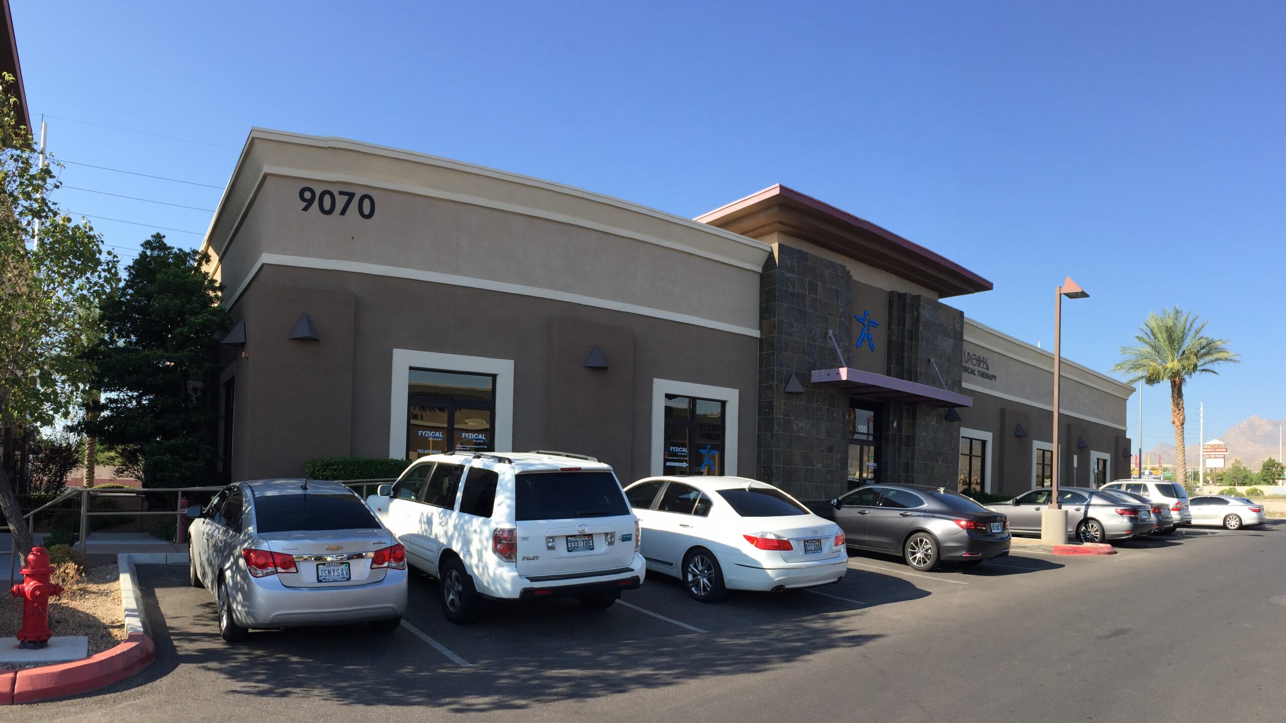 Brown building with tile accent sold as Las Vegas commercial real estate