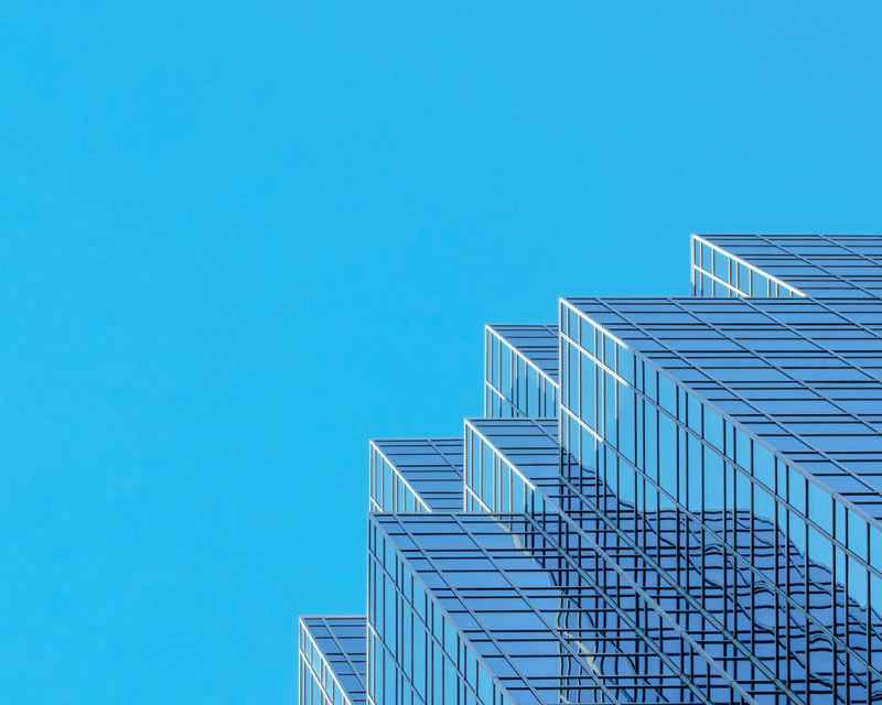 Commercial building against blue sky